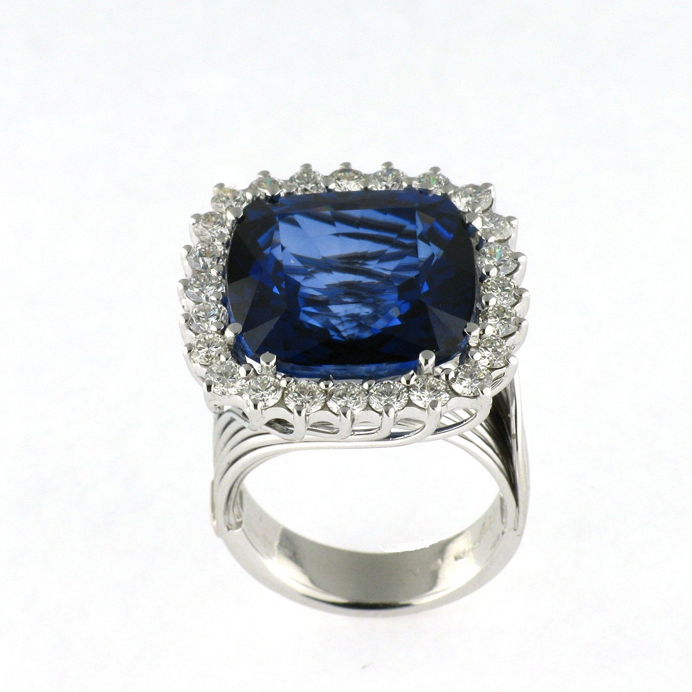Ring with Diamonds and blue Sapphire cushion